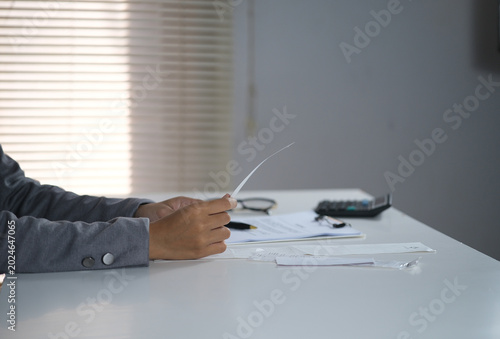 Quadro su tela An accountant reviews receipts