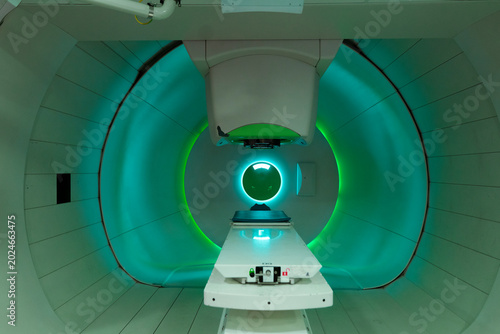 Proton therapy machine in a modern medical facility for cancer treatment.