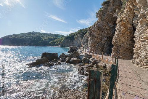 Road under the cliff along the seashore