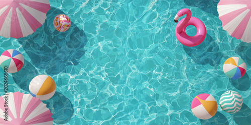 Top view of a swimming pool with copy space, pink pastel inflatable floatings balloons and flamingo buoy, summer background