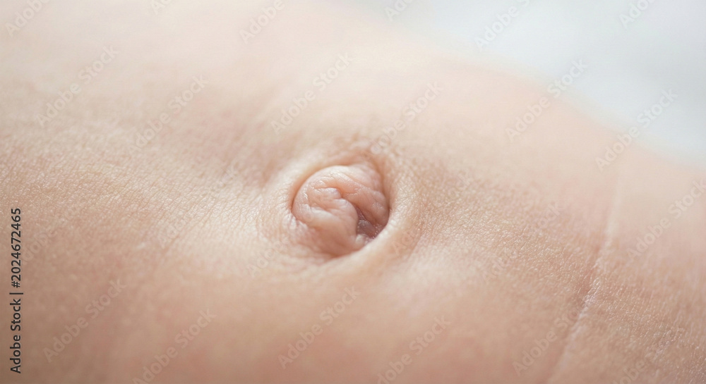 Fototapeta premium An extreme macro of a baby's navel to advertise medical care or a wellness campaign for pregnant women