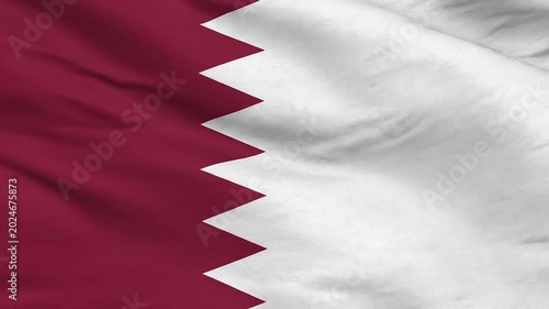 Qatari flag waving gently in clear sunlight