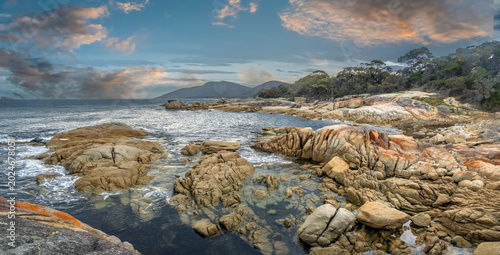 Dramatic dusk scenery in Binalong Bay, Bay of Fires, northeastern Tasmania, Australia