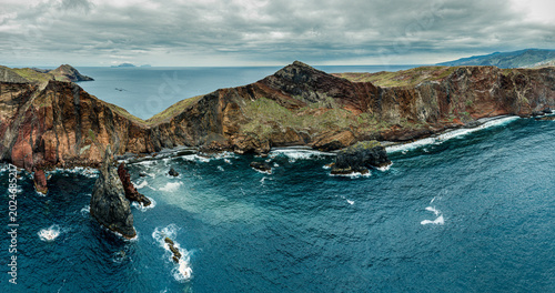 Schilderij op canvas Aerial drone view of the Madeira coastline with steep cliffs, Atlantic Ocean, and natural landscape