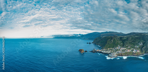 Bild auf Leinwand Aerial drone view of the Madeira coastline with steep cliffs, Atlantic Ocean, and natural landscape