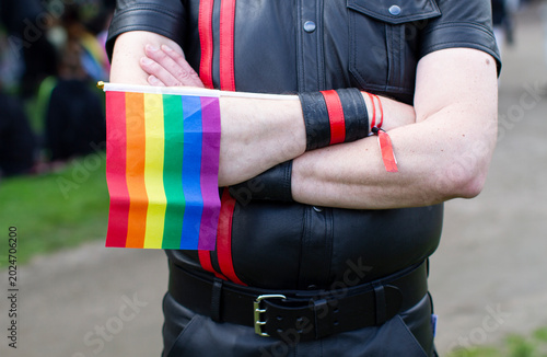 Fragment of a male body with Pride symbols - a rainbow flag