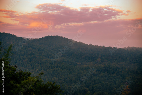 The natural background of the beautiful twilight sky, the surrounding atmosphere (trees, rivers, mountains) is a beautiful view of the journey, the view point.