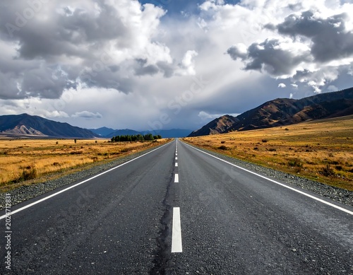 Empty highway stretches through vast, scenic plains