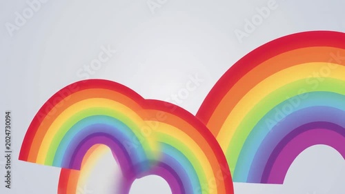 Double rainbow illustration, overlapping colorful arcs on light gray background