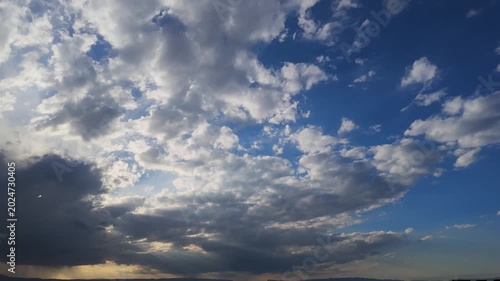Fast Moving White Clouds Over Blue Sky Timelapse