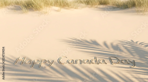 Happy canada day message written in sand on beach Canada Day