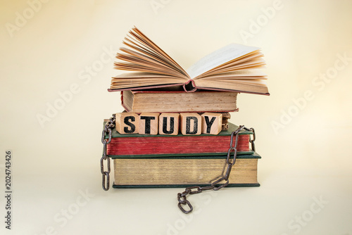 Canvas Print Study will set you free, still life concept with stacked  books and broken chain