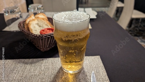 Canvas-taulu Glass of cold Cisk lager beer, Maltese iconic beer in Malta