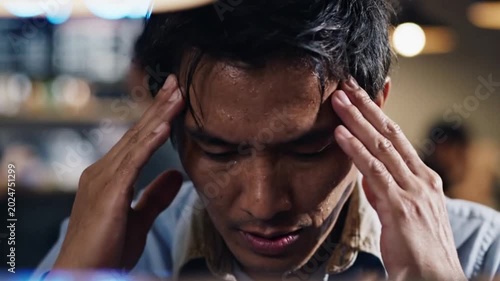 Stressed employee under corporate pressure facing failure