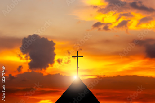 Tablou pe pânză Dramatic sunset sky featuring cross silhouette atop pyramid with explosion cloud