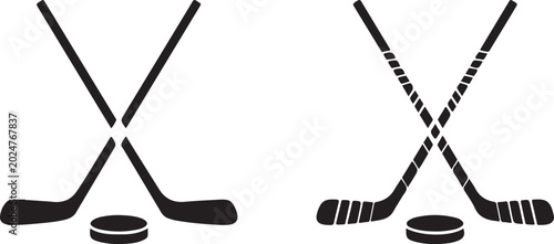 Photography Ice hockey sticks and puck crossed over