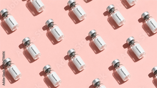 medical vial with hormone medication. Pharmaceutical glass bottles arranged in pattern on table. Concept of health, science, treatment, pharmacology, biotechnology and medicine research