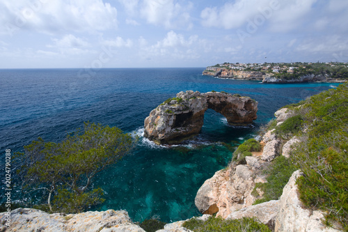 A gate-shaped rock off the coast of the island of Mallorca in the Mediterranean Sea