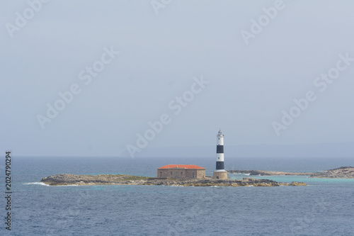 A lighthouse on an island in the Mediterranean Sea