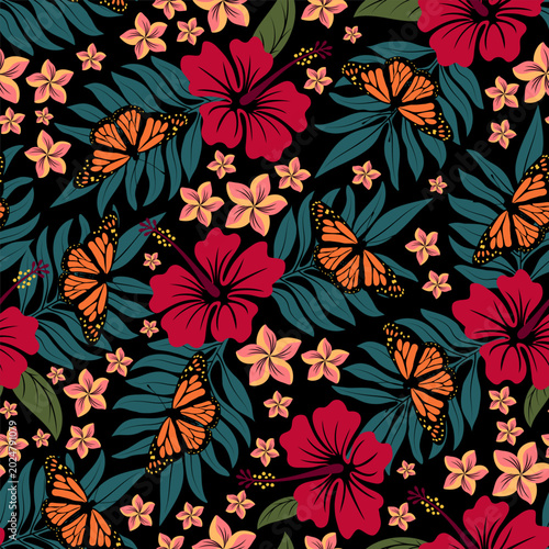 Tropical theme seamless pattern with butterflies, foliage, hibiscus and plumeria flowers. Vector illustration.