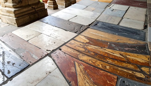 Close up of multicolored stone floor with intricate patterns and textures