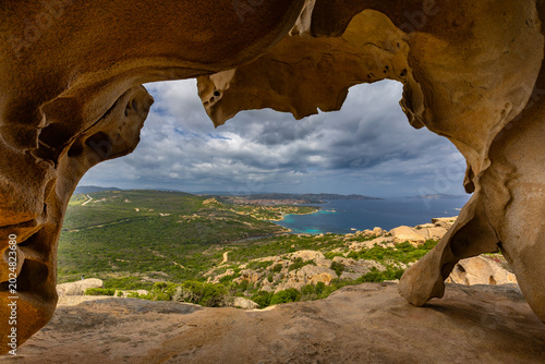 Bild auf Leinwand View of the Sardinian Coastline from a Natural Rock Arch, Roccia dell'Orso, Sard