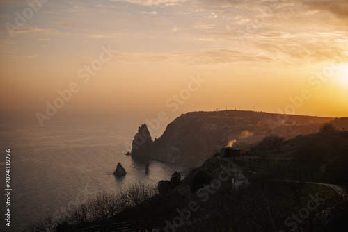 Canvas Print Rocky sea coast at golden sunset