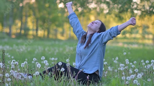 Happy Peaceful Woman Relaxing On Green Dandelion Meadow In Summer Park Video
