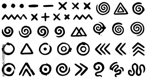 Fotografie Hand-drawn style chevron marks and tribal target circles vector