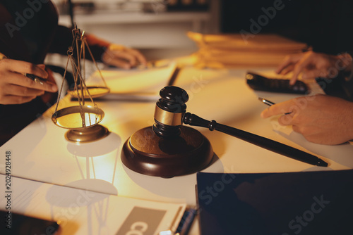 Close up of businessmen or lawyers discussing contract or business agreement at law firm office, Business people making deal document legal, justice advice service concept.