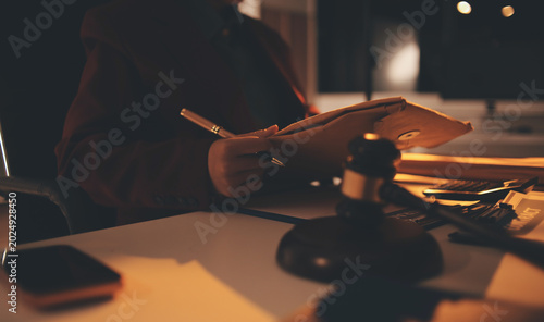 Close up of businessmen or lawyers discussing contract or business agreement at law firm office, Business people making deal document legal, justice advice service concept.