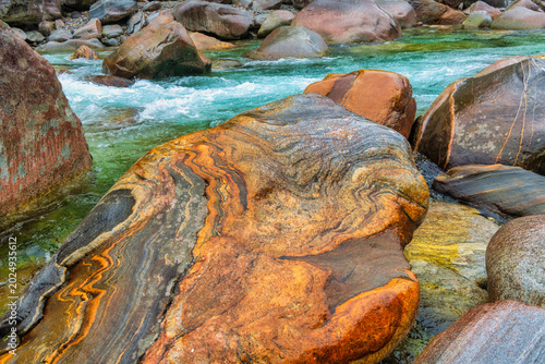 Mountain River Verzasca with granite stone in front 