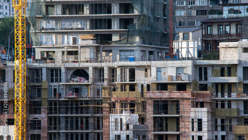 Foto Close Up of Skyscraper Building Construction Site and Scaffolding