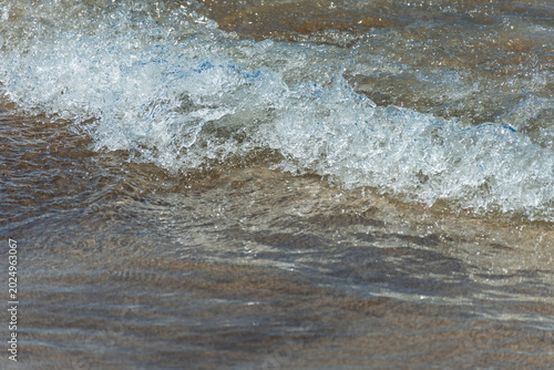 Foam from the waves on the seashore.