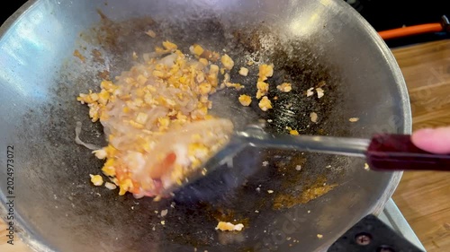 Closeup of Making Pad Thai with Shrimp in a Wok