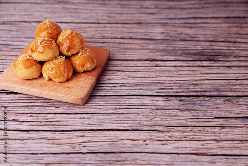 Vászonkép Kue Nastar or Golden pastries rest on a wooden board
