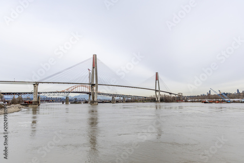 Cable-Stayed Bridge Over the Fraser River in New Westminster Vancouver BC Canada With Urban Waterfront Skyline
