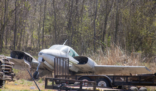 Tableau sur toile Derelict twin-engine aircraft in a junk yard
