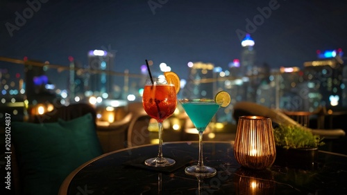 rooftop. Colorful drinks in glasses on a rooftop table at night, illuminated by city lights. bar promotions, beverage menus, designed for product packaging and bar promotions, used by clinicians.