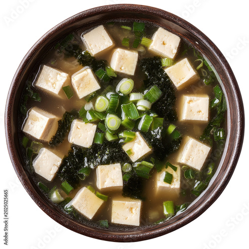 Top view of a bowl of miso soup with tofu cubes and green onions isolated on transparent background