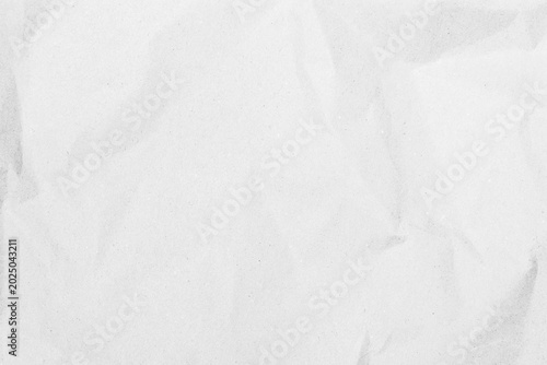 White recycled craft paper texture as background. Grey paper texture, Old vintage page or grunge vignette of old newspaper. Pattern rough art creased grunge letter. Hardboard with copy space for text.