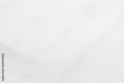 White recycled craft paper texture as background. Grey paper texture, Old vintage page or grunge vignette of old newspaper. Pattern rough art creased grunge letter. Hardboard with copy space for text.