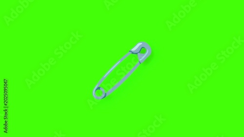 Safety Pin Rotating on Green Screen, Close-Up View of a Metal Fastener.