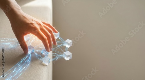 Person's hand touching a glowing lightbulb symbolizing innovative ideas and creativity in workflow reshaping context