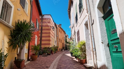 Narrow Colorful Street with Potted Plants in Cassis France