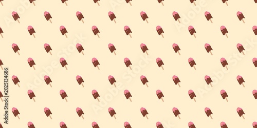 Obraz na płótnie Cheerful seamless pattern with chocolate ice cream popsicles arranged in alternate diagonal directions on a pastel yellow background