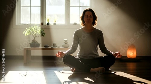 Woman Meditating in a Serene Indoor Space