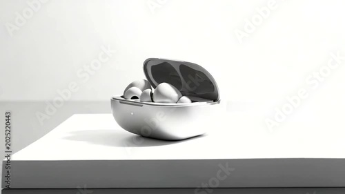 Wireless earbuds case open on minimalist white table