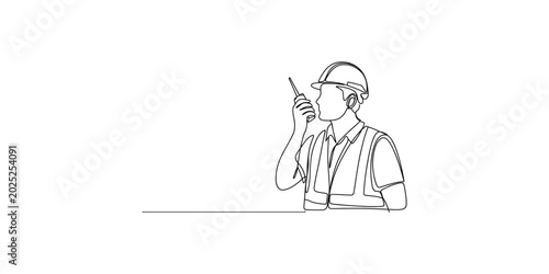A construction worker wearing a hard hat and safety vest talking on a walkietalkie isolated on white background