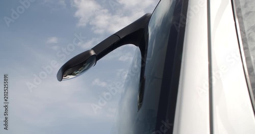 Driver front visibility mirror on modern truck  blind spot cloud reflections on window